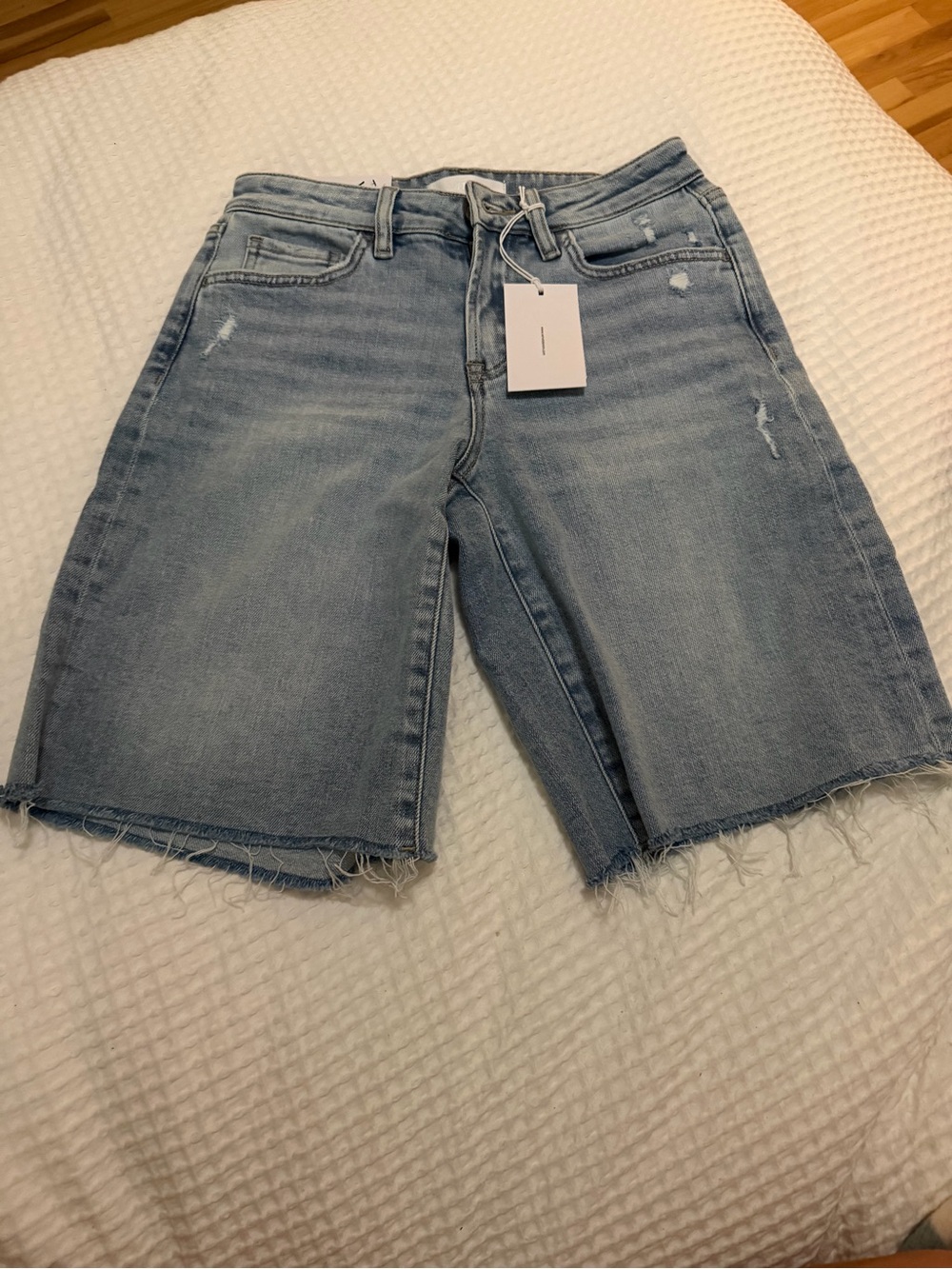 Light Blue Distressed Denim Bermuda Shorts with Raw Hem